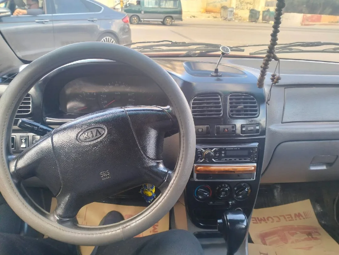 سياره كيا ريو 2002خالي قص قلبان قير اوتوماتيك منتهي ترخيصها الها 6شهورسعر البيع