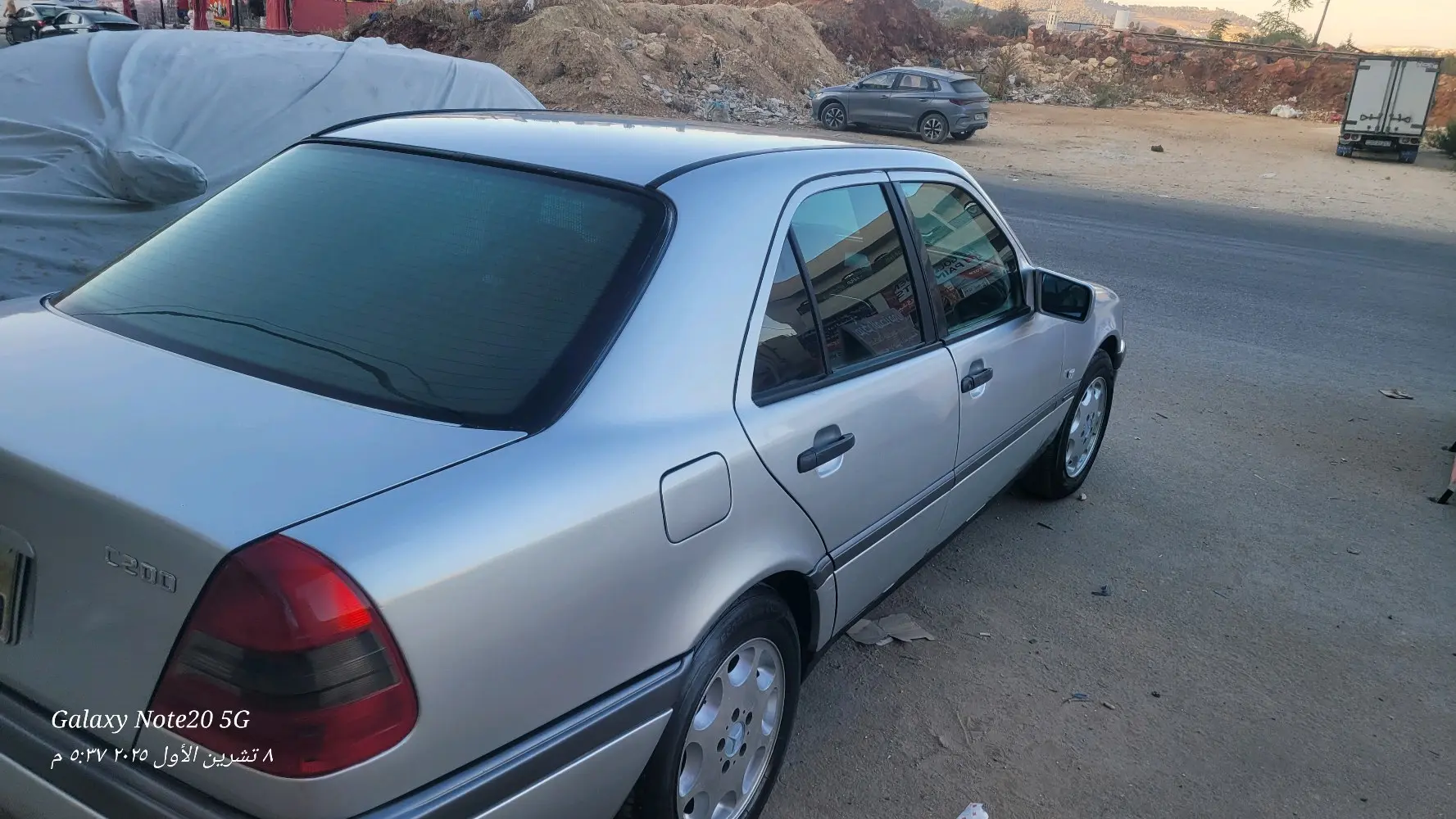 بسم الله الرحمن الرحيمللبيمرسيدس بنز C200 موديل 1997 أصلي لون سلفرماتور 2000cc ا